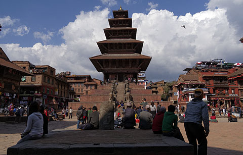 People relaxing at Nyatpola at Taumadhi Square, Bhaktapur, Nepal